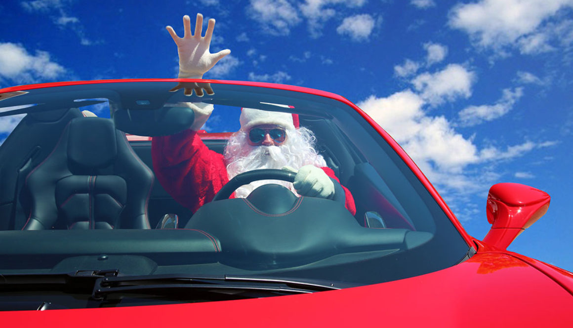 Santa Claus. Santa Drives fast in his Red Sports Car with a Blue